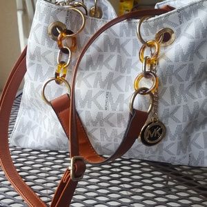 white "MK" bag